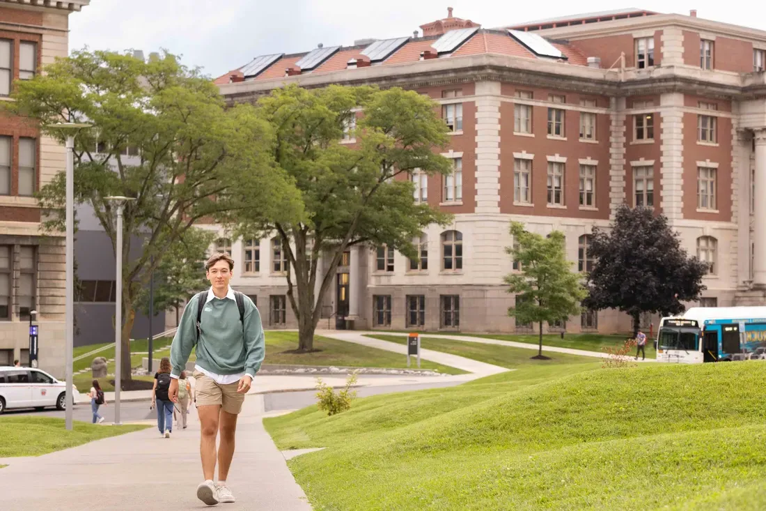 Student walking on campus.